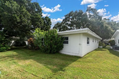 This beautiful renovated block-constructed home is in the 55+ on Mainlands Golf Club in Florida - for sale on GolfHomes.com, golf home, golf lot