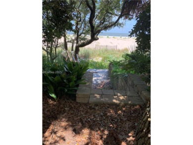 Just steps from the beach, this beautifully maintained 3-bedroom on Port Royal Golf and Racquet Club in South Carolina - for sale on GolfHomes.com, golf home, golf lot