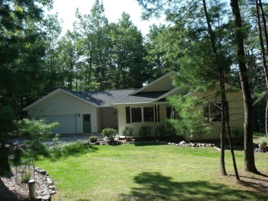 Pride of Ownership shows in this Custom Built Home. Four on Indian River Golf Club in Michigan - for sale on GolfHomes.com, golf home, golf lot