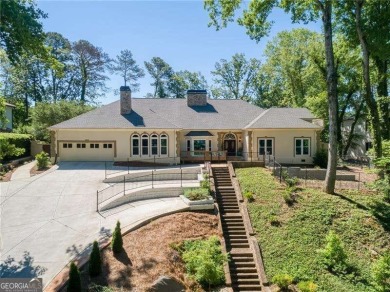 Tucked in Atlanta Country Club's quiet interior, this stately on Atlanta Country Club in Georgia - for sale on GolfHomes.com, golf home, golf lot