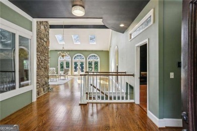 Tucked in Atlanta Country Club's quiet interior, this stately on Atlanta Country Club in Georgia - for sale on GolfHomes.com, golf home, golf lot