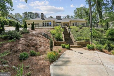 Tucked in Atlanta Country Club's quiet interior, this stately on Atlanta Country Club in Georgia - for sale on GolfHomes.com, golf home, golf lot