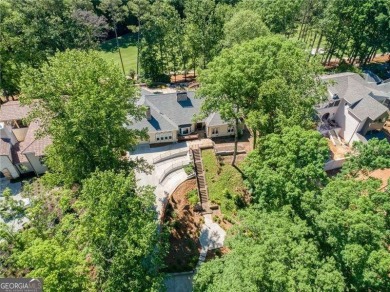Tucked in Atlanta Country Club's quiet interior, this stately on Atlanta Country Club in Georgia - for sale on GolfHomes.com, golf home, golf lot