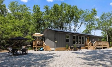 Welcome to your private retreat in the woods! This custom-built on Linn Valley Lakes - Deer Trace Golf Course in Kansas - for sale on GolfHomes.com, golf home, golf lot