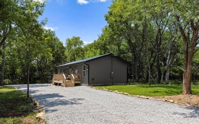 Welcome to your private retreat in the woods! This custom-built on Linn Valley Lakes - Deer Trace Golf Course in Kansas - for sale on GolfHomes.com, golf home, golf lot