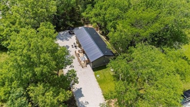 Welcome to your private retreat in the woods! This custom-built on Linn Valley Lakes - Deer Trace Golf Course in Kansas - for sale on GolfHomes.com, golf home, golf lot