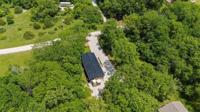 Welcome to your private retreat in the woods! This custom-built on Linn Valley Lakes - Deer Trace Golf Course in Kansas - for sale on GolfHomes.com, golf home, golf lot