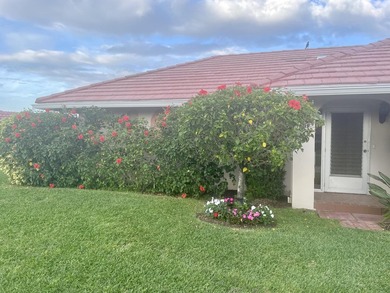 WATERFRONT GEM! Discover one of the largest villas in the highly on Atlantis Golf Club in Florida - for sale on GolfHomes.com, golf home, golf lot