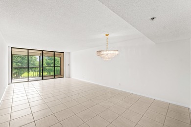 Discover this beautifully located condo in the highly on The Country Club At Boca Raton in Florida - for sale on GolfHomes.com, golf home, golf lot