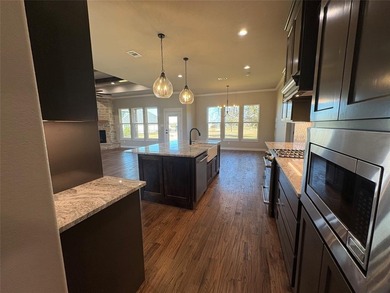 Welcome to 3714 Tremont Ln, Granbury, TX 76049; an open-concept on Pecan Plantation Country Club in Texas - for sale on GolfHomes.com, golf home, golf lot