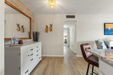 You will love coming home to this beautiful two-bedroom on Gulf Harbors Golf Course in Florida - for sale on GolfHomes.com, golf home, golf lot