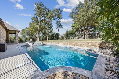 Located on a quiet cul-de-sac in the guard gated enclave of on Trophy Club of Dallas in Texas - for sale on GolfHomes.com, golf home, golf lot