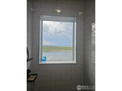 This beautiful 4 bed, 3.5 bath townhome offers lakefront living on Highland Meadows Golf Course in Colorado - for sale on GolfHomes.com, golf home, golf lot