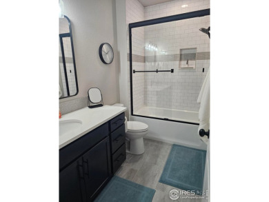 This beautiful 4 bed, 3.5 bath townhome offers lakefront living on Highland Meadows Golf Course in Colorado - for sale on GolfHomes.com, golf home, golf lot