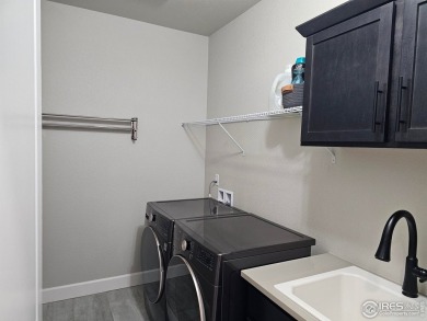This beautiful 4 bed, 3.5 bath townhome offers lakefront living on Highland Meadows Golf Course in Colorado - for sale on GolfHomes.com, golf home, golf lot