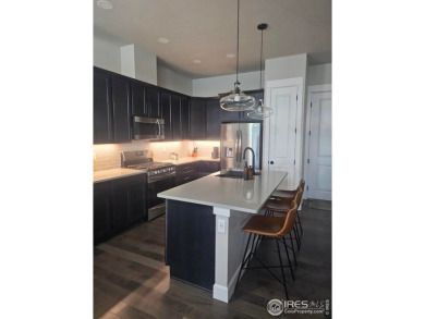This beautiful 4 bed, 3.5 bath townhome offers lakefront living on Highland Meadows Golf Course in Colorado - for sale on GolfHomes.com, golf home, golf lot