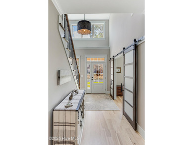 A fresh take on coastal living-this home offers a quieter, more on Carolina National Golf Club in North Carolina - for sale on GolfHomes.com, golf home, golf lot