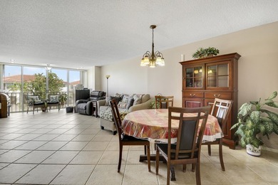 Sun-splashed and move-in ready, this airy second-floor residence on Fountains Golf and Country Club in Florida - for sale on GolfHomes.com, golf home, golf lot