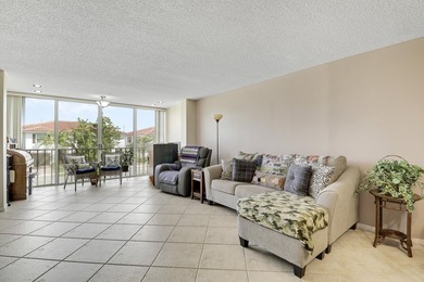 Sun-splashed and move-in ready, this airy second-floor residence on Fountains Golf and Country Club in Florida - for sale on GolfHomes.com, golf home, golf lot