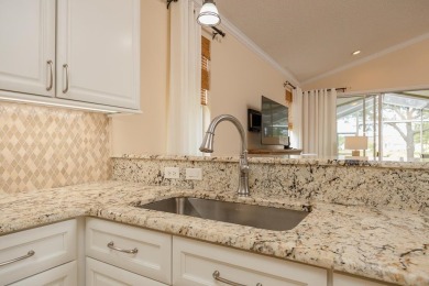 Bright,Cheerful & Immaculate Waterfront Home In Premier 55+ on Slammer and Squire Golf Course in Florida - for sale on GolfHomes.com, golf home, golf lot
