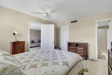 Sun-splashed and move-in ready, this airy second-floor residence on Fountains Golf and Country Club in Florida - for sale on GolfHomes.com, golf home, golf lot