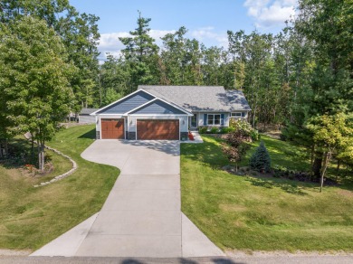 Meticulously maintained and beautifully updated, this stunning on Indian River Golf Club in Michigan - for sale on GolfHomes.com, golf home, golf lot