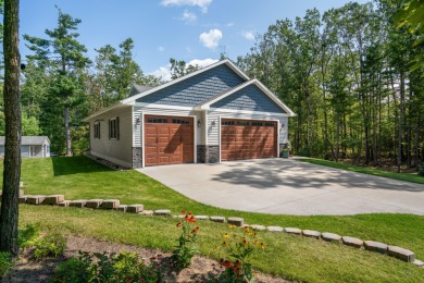 Meticulously maintained and beautifully updated, this stunning on Indian River Golf Club in Michigan - for sale on GolfHomes.com, golf home, golf lot