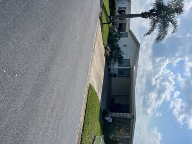 / **THIS HOME IS ON LEASED LAND WITH A MONTHLY LOT FEE ****  Big on Hamptons Golf Club in Florida - for sale on GolfHomes.com, golf home, golf lot