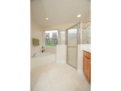 Bright,Cheerful & Immaculate Waterfront Home In Premier 55+ on Slammer and Squire Golf Course in Florida - for sale on GolfHomes.com, golf home, golf lot