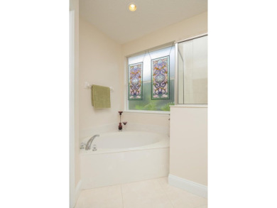Bright,Cheerful & Immaculate Waterfront Home In Premier 55+ on Slammer and Squire Golf Course in Florida - for sale on GolfHomes.com, golf home, golf lot