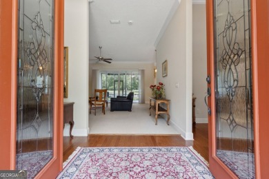 Step into a world of elegance and comfort with this timeless on Laurel Island Links in Georgia - for sale on GolfHomes.com, golf home, golf lot