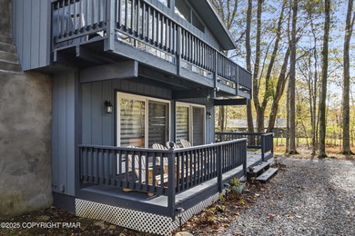 Tucked beneath a canopy of whispering trees, this modern chalet on Pocono Farms Country Club in Pennsylvania - for sale on GolfHomes.com, golf home, golf lot