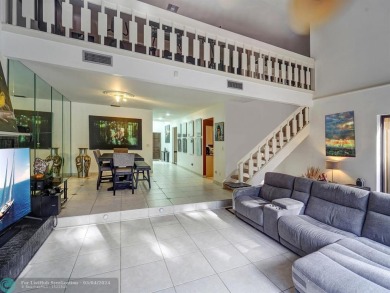 From the moment you enter you are greeted with natural light on Jacaranda Golf Club in Florida - for sale on GolfHomes.com, golf home, golf lot