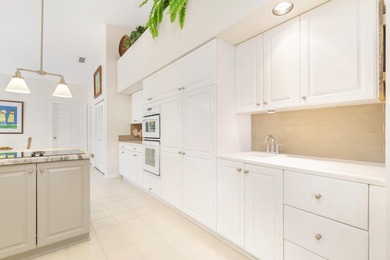 Located on the 14th hole in prestigious Jupiter Hills Village on Jupiter Hills Club in Florida - for sale on GolfHomes.com, golf home, golf lot