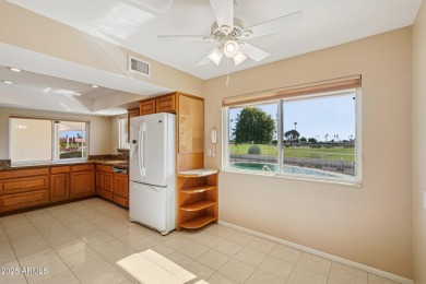 This spacious Columbine model sits on a large lot with on Sun City Lakes West and East in Arizona - for sale on GolfHomes.com, golf home, golf lot