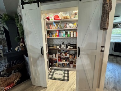 Virtually a full remodel since ownership on this very inviting on Riverbend Golf and Country Club in Florida - for sale on GolfHomes.com, golf home, golf lot