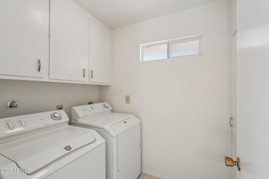 This spacious Columbine model sits on a large lot with on Sun City Lakes West and East in Arizona - for sale on GolfHomes.com, golf home, golf lot