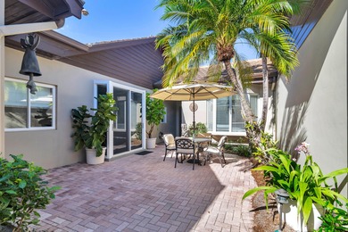 Located on the 14th hole in prestigious Jupiter Hills Village on Jupiter Hills Club in Florida - for sale on GolfHomes.com, golf home, golf lot