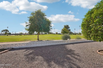 This spacious Columbine model sits on a large lot with on Sun City Lakes West and East in Arizona - for sale on GolfHomes.com, golf home, golf lot