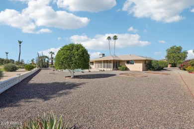 This spacious Columbine model sits on a large lot with on Sun City Lakes West and East in Arizona - for sale on GolfHomes.com, golf home, golf lot