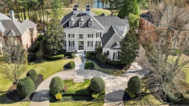 This extraordinary estate in the prestigious Windward community on The Golf Club of Georgia in Georgia - for sale on GolfHomes.com, golf home, golf lot