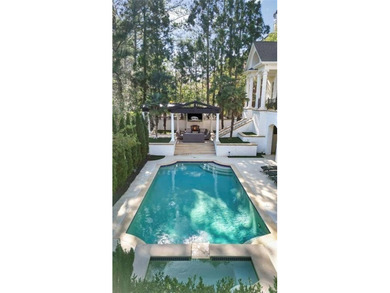 This extraordinary estate in the prestigious Windward community on The Golf Club of Georgia in Georgia - for sale on GolfHomes.com, golf home, golf lot