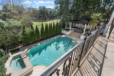 This extraordinary estate in the prestigious Windward community on The Golf Club of Georgia in Georgia - for sale on GolfHomes.com, golf home, golf lot