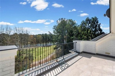 This extraordinary estate in the prestigious Windward community on The Golf Club of Georgia in Georgia - for sale on GolfHomes.com, golf home, golf lot