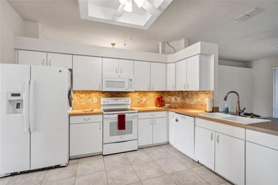 One or more photos have been virtually stagede take a look at on Kings Ridge Golf Club in Florida - for sale on GolfHomes.com, golf home, golf lot