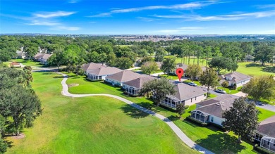 One or more photos have been virtually stagede take a look at on Kings Ridge Golf Club in Florida - for sale on GolfHomes.com, golf home, golf lot