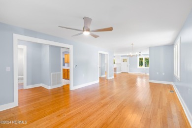 This spacious beach house offers extensive modern updates with on Oak Island Golf Club in North Carolina - for sale on GolfHomes.com, golf home, golf lot