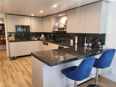 This exceptional corner unit offers stunning south and on Desert Island Golf and Country Club in California - for sale on GolfHomes.com, golf home, golf lot