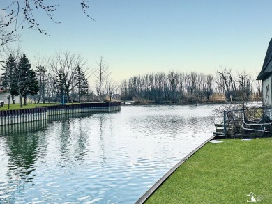 Tucked away on a peaceful dead-end street, this beautifully on Lake Erie Metropark Golf Course in Michigan - for sale on GolfHomes.com, golf home, golf lot