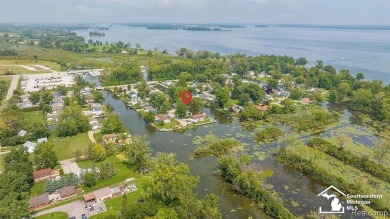 Tucked away on a peaceful dead-end street, this beautifully on Lake Erie Metropark Golf Course in Michigan - for sale on GolfHomes.com, golf home, golf lot